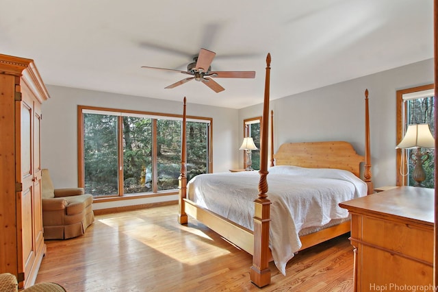 bedroom with light hardwood / wood-style flooring and ceiling fan