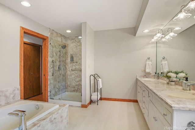 bathroom featuring a notable chandelier, separate shower and tub, and dual bowl vanity