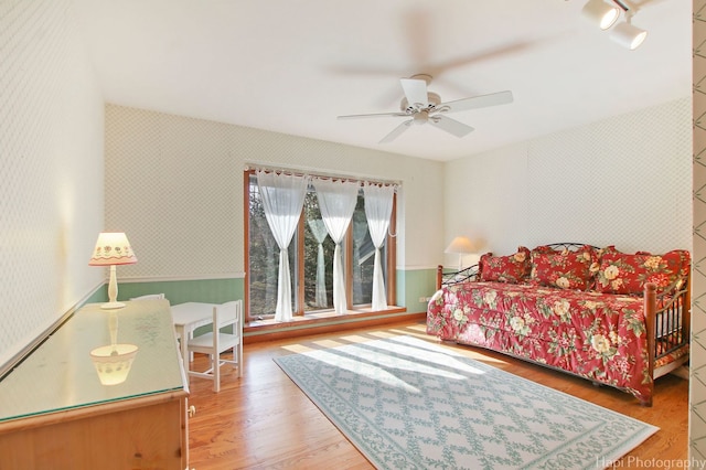 bedroom featuring hardwood / wood-style floors and ceiling fan