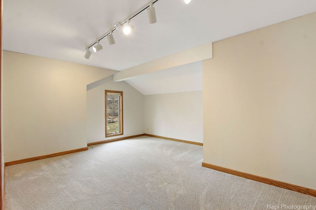 bonus room featuring light carpet and lofted ceiling