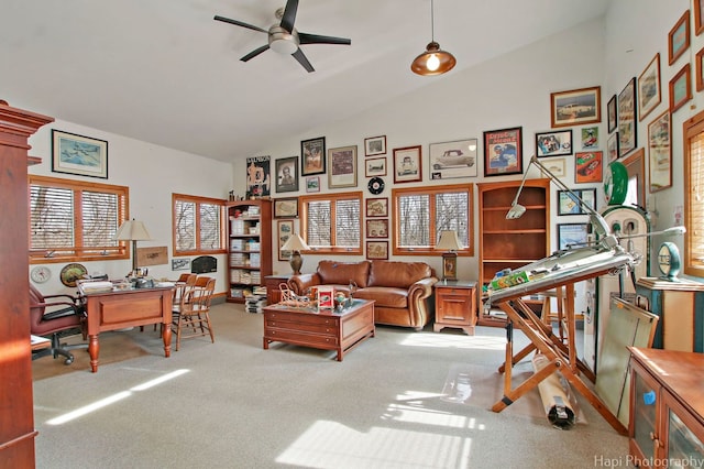 sitting room with light colored carpet, ceiling fan, and vaulted ceiling