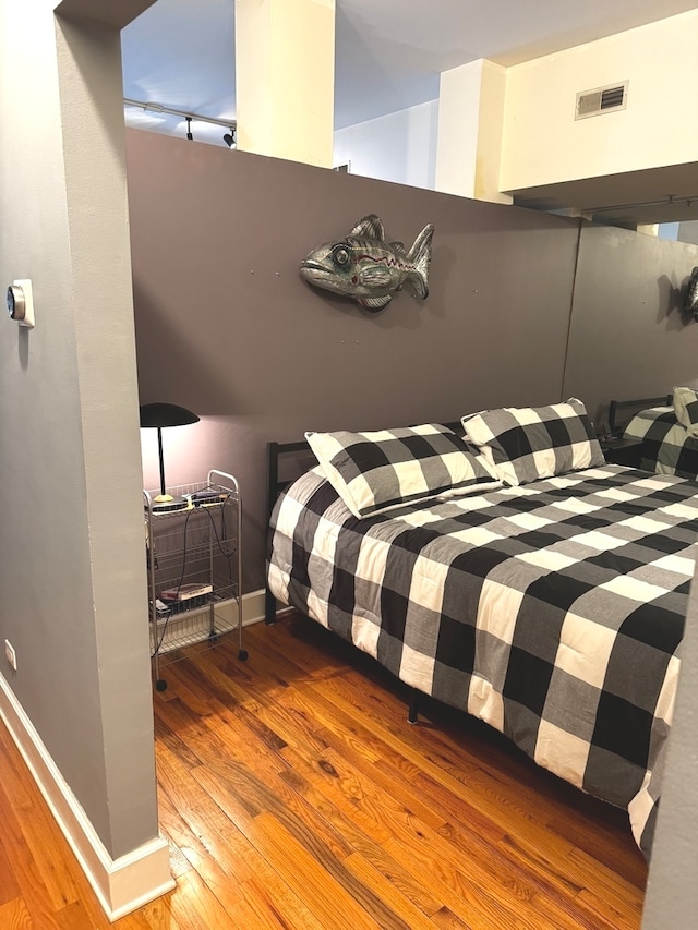 bedroom featuring hardwood / wood-style floors