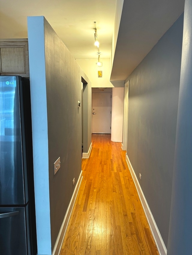 corridor featuring light hardwood / wood-style floors