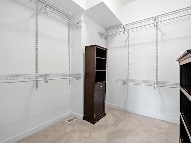 walk in closet with carpet and visible vents