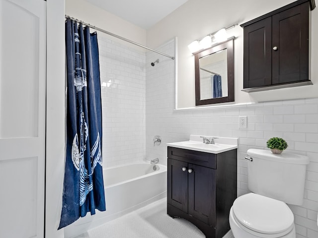 bathroom with tile walls, toilet, shower / bath combo, vanity, and tile patterned flooring