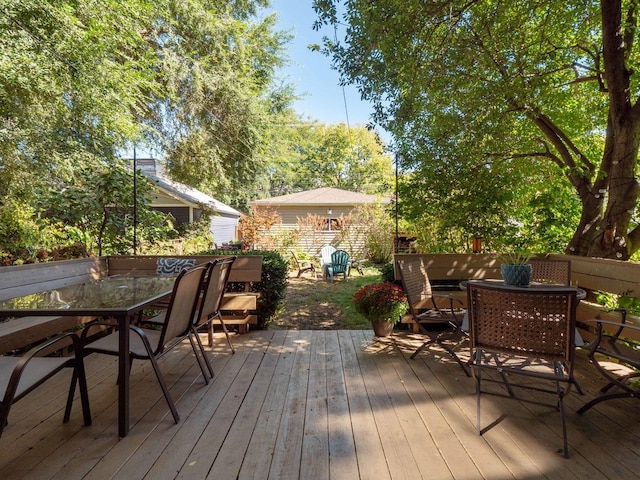 deck with outdoor dining area