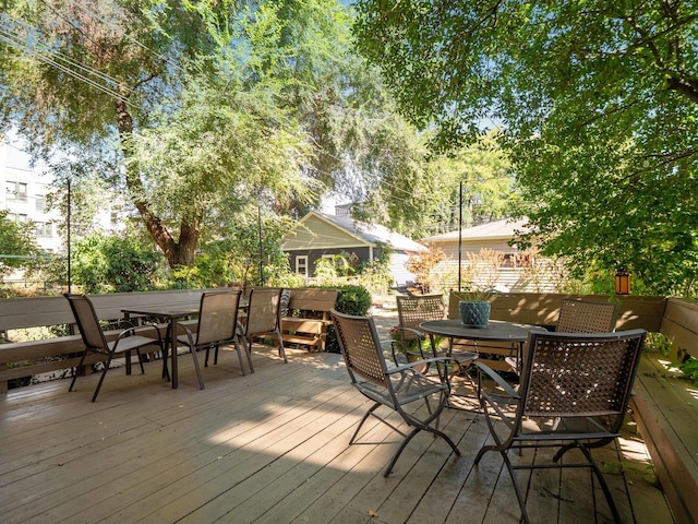 deck with outdoor dining area