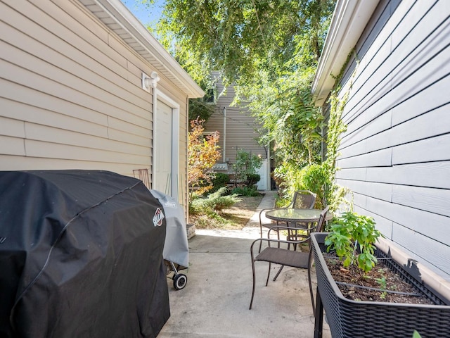 view of patio / terrace with outdoor dining space and grilling area