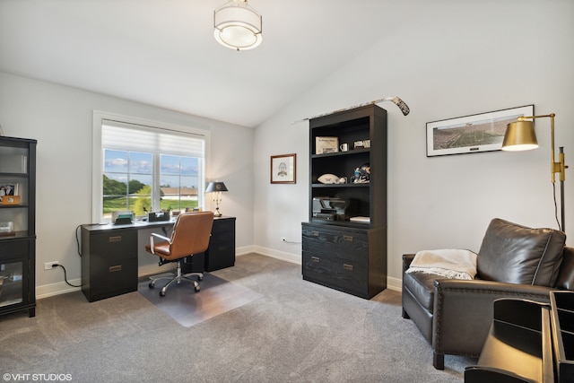 carpeted office space with lofted ceiling