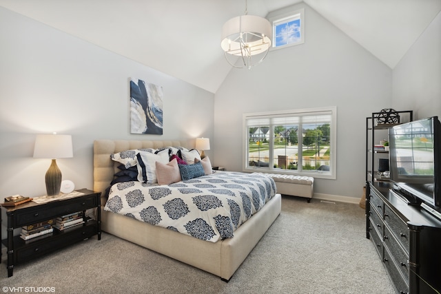 bedroom with high vaulted ceiling, light carpet, and a chandelier