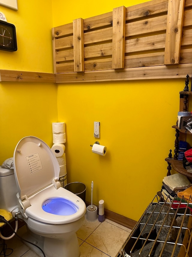 bathroom with tile floors and toilet