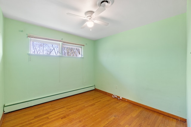 unfurnished room featuring ceiling fan, a baseboard radiator, and light wood-type flooring