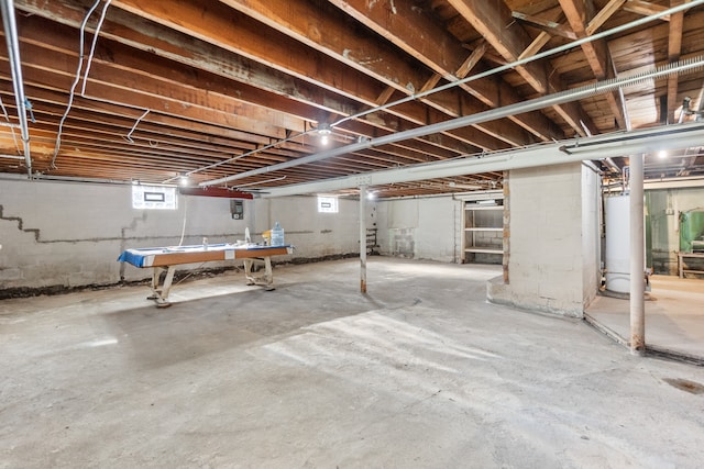 basement featuring water heater and pool table