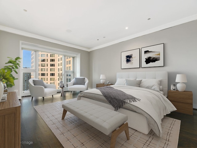 bedroom featuring dark hardwood / wood-style floors and crown molding