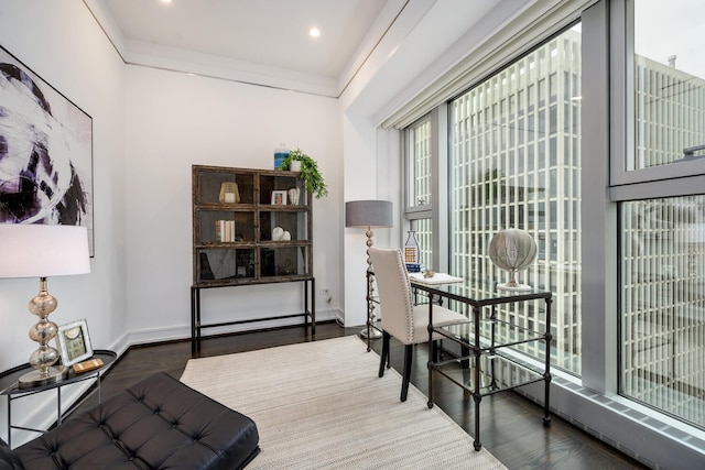 interior space with wood-type flooring and crown molding