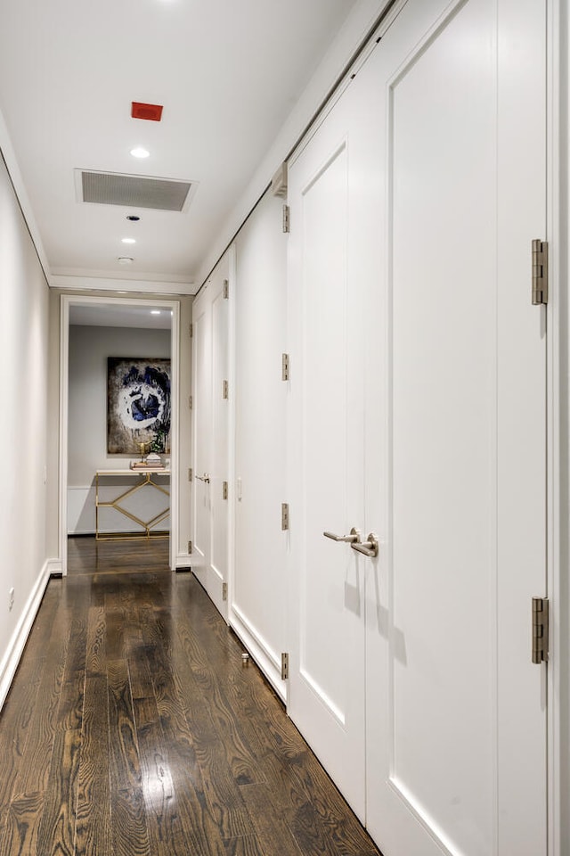 hall with dark hardwood / wood-style flooring