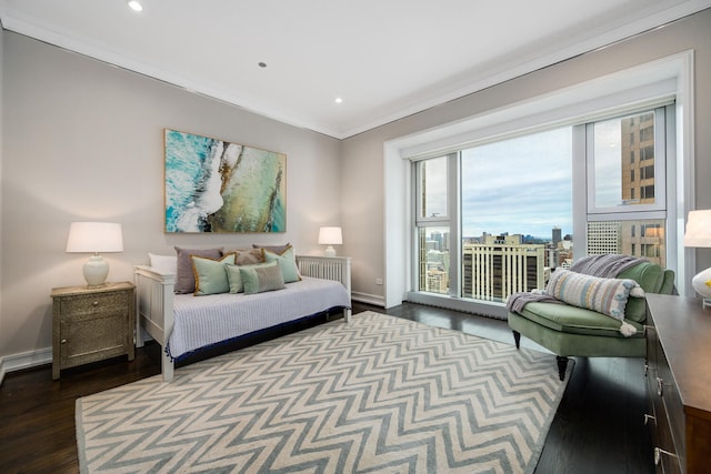 bedroom with access to exterior, crown molding, and hardwood / wood-style flooring