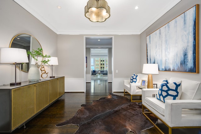 living room featuring crown molding and dark hardwood / wood-style flooring