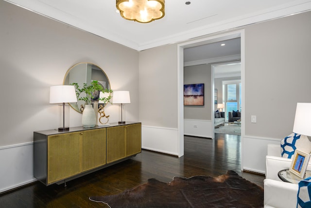 corridor featuring ornamental molding and dark hardwood / wood-style flooring