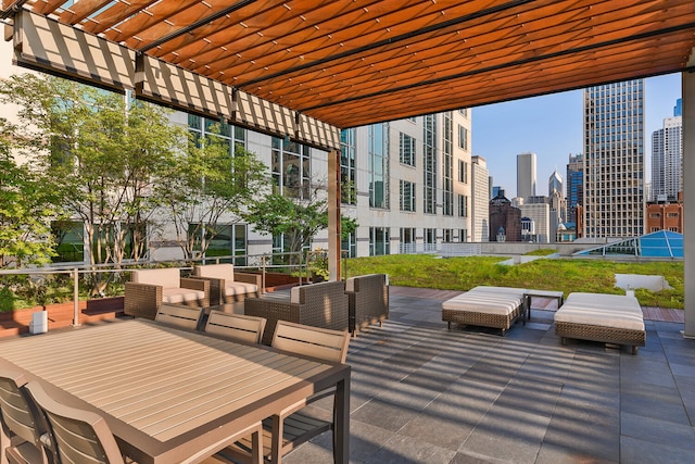 view of patio featuring an outdoor living space and a pergola