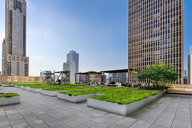 surrounding community featuring a lawn and a patio area