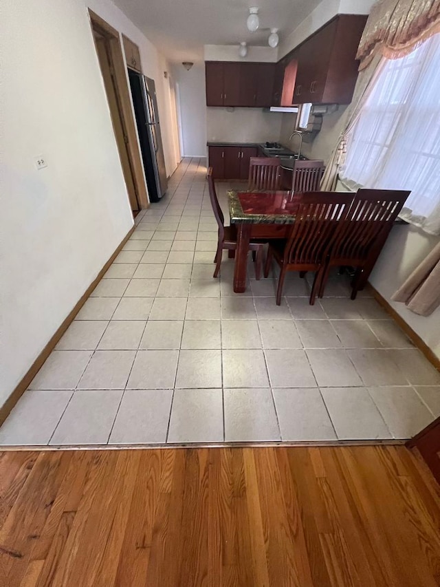 dining room featuring light tile floors