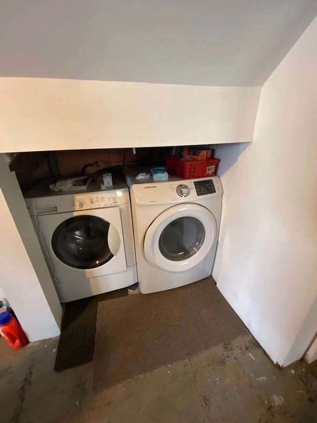 laundry area with independent washer and dryer