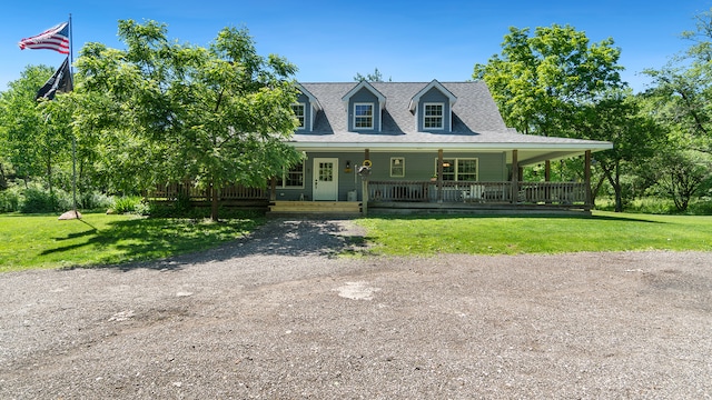 view of front of property featuring a porch and a front lawn