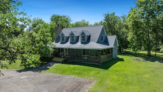 view of front of home with a porch and a front lawn