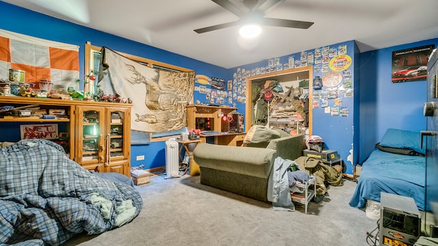 carpeted bedroom featuring ceiling fan