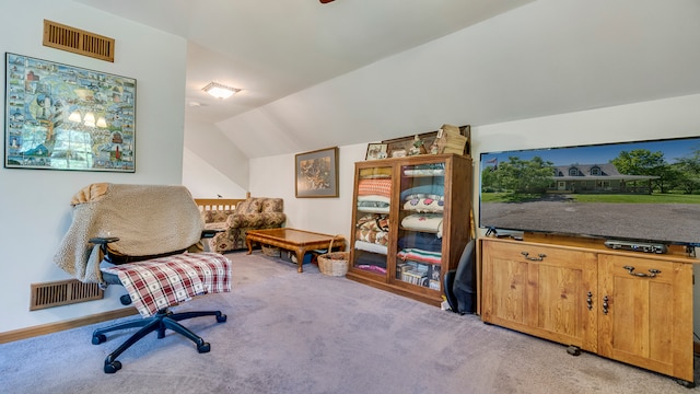 office space with light carpet and lofted ceiling