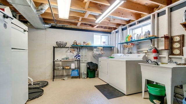 clothes washing area featuring washing machine and clothes dryer