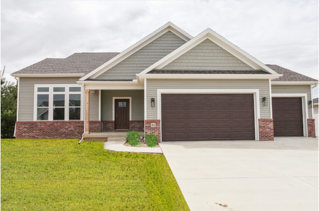 craftsman-style house with a garage and a front lawn