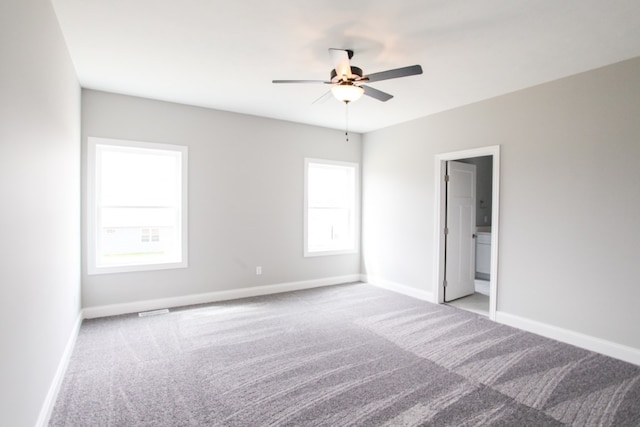 unfurnished room with carpet floors and ceiling fan