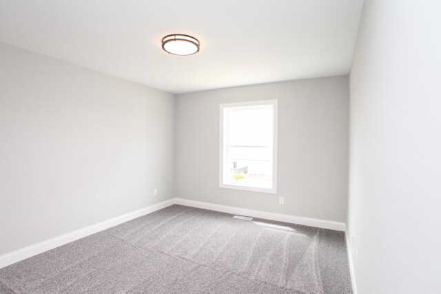 spare room with carpet flooring