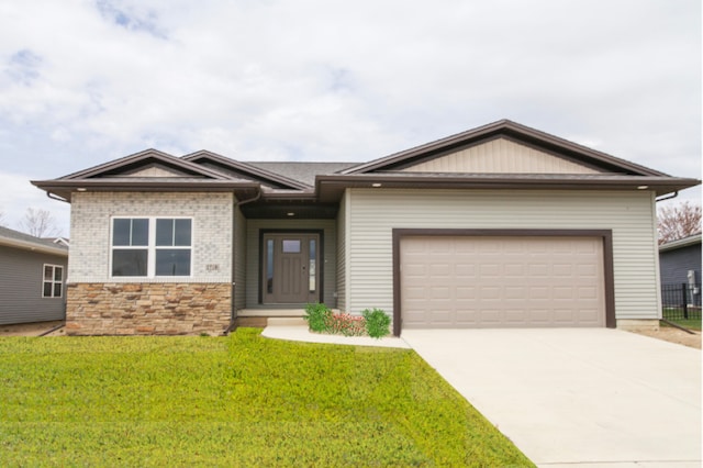 view of front of house with a garage and a front yard