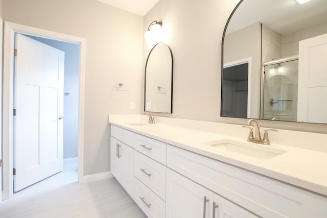 bathroom featuring double vanity and tile floors