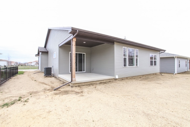 back of house with a patio area and central AC unit