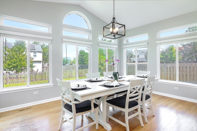 11 N Berkshire Ln, Round Lake, IL 60073 - sunroom featuring plenty of natural light, a chandelier, and lofted ceiling