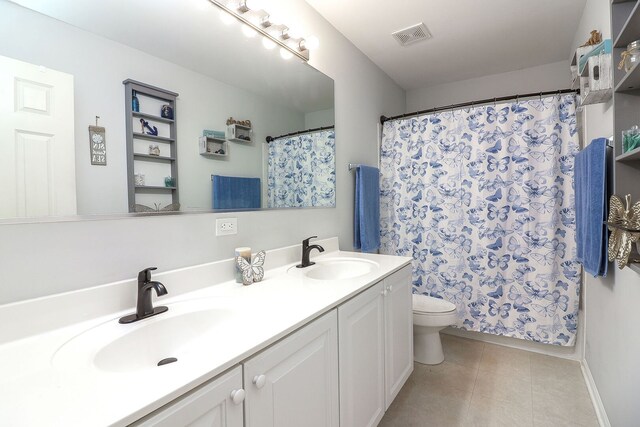 11 N Berkshire Ln, Round Lake, IL 60073 - bathroom with double vanity, a shower with shower curtain, and tile patterned floors