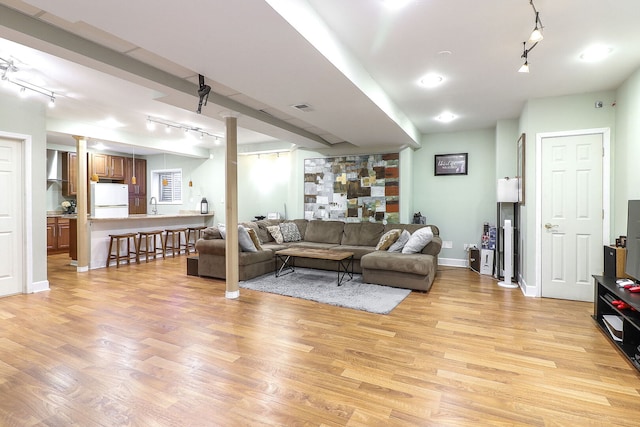 11 N Berkshire Ln, Round Lake, IL 60073 - living room featuring rail lighting and light wood finished floors