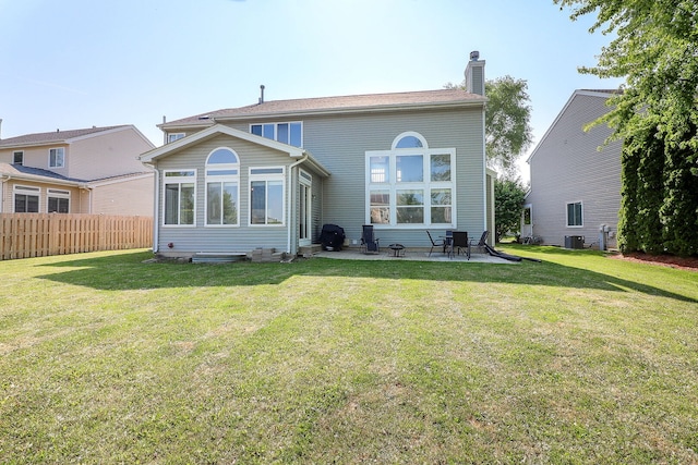 11 N Berkshire Ln, Round Lake, IL 60073 - rear view of property with a chimney and a patio