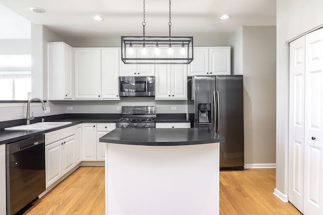 11 N Berkshire Ln, Round Lake, IL 60073 - kitchen with appliances with stainless steel finishes, light wood finished floors, white cabinets, dark countertops, and recessed lighting