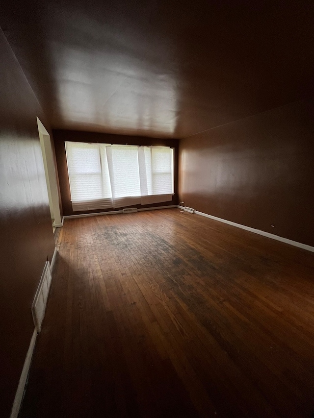 empty room featuring dark hardwood / wood-style floors