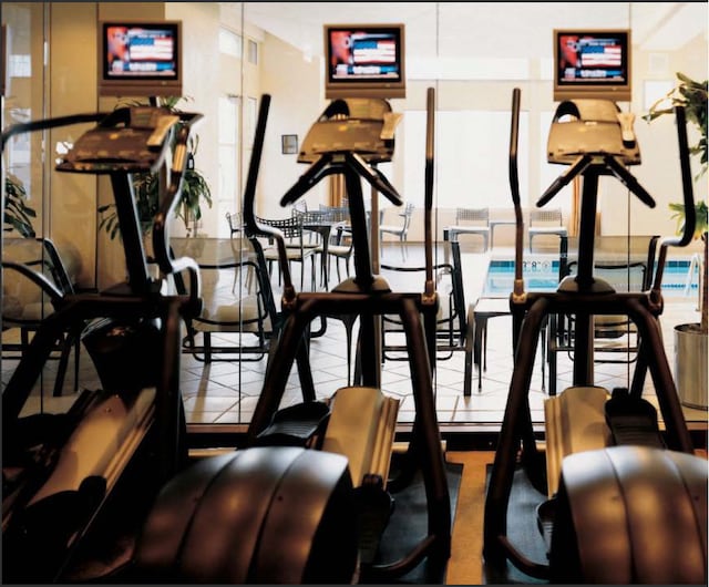 workout area with tile floors