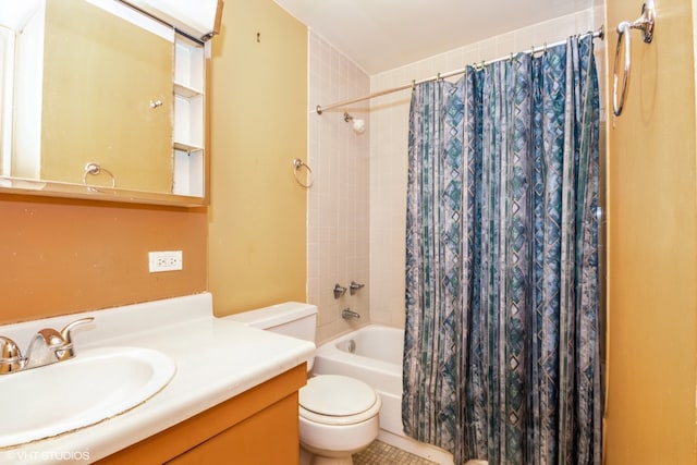 full bathroom featuring oversized vanity, tile floors, toilet, and shower / bath combo with shower curtain