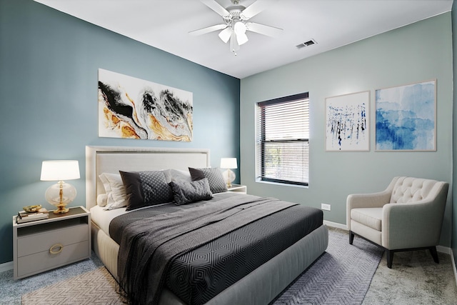 bedroom with ceiling fan and light carpet