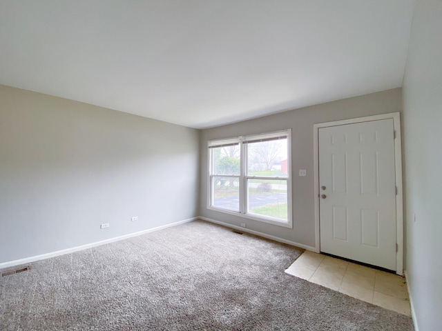 view of carpeted entrance foyer