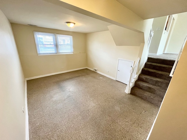 staircase featuring tile floors