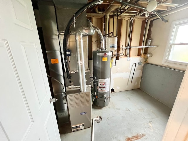 utility room featuring gas water heater